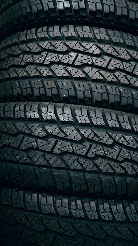Tires and wheel services close-up of tire tread pattern for traction and wear inspection.